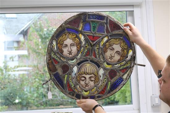 A set of eleven 19th century stained glass roundels, diameter 24in.